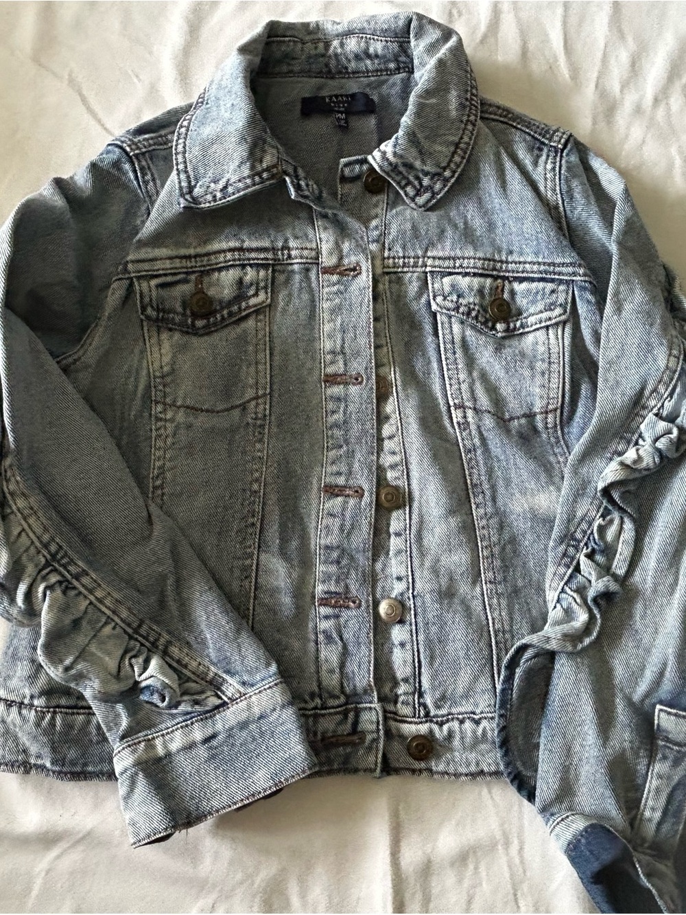 Kaari Blue Light Wash Denim Jacket - Faded Blue ruffled arms and back